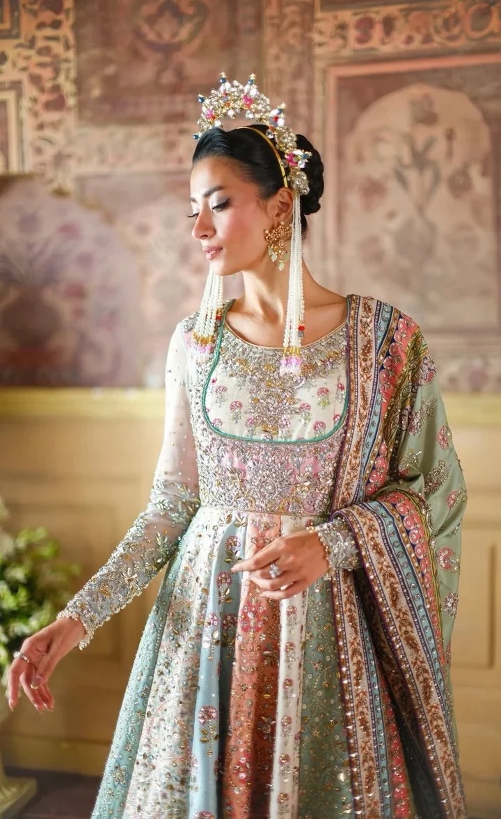 NOMI ANSARI – MARYAM NAWAZ SHARIF clothing in pink, mint tones.